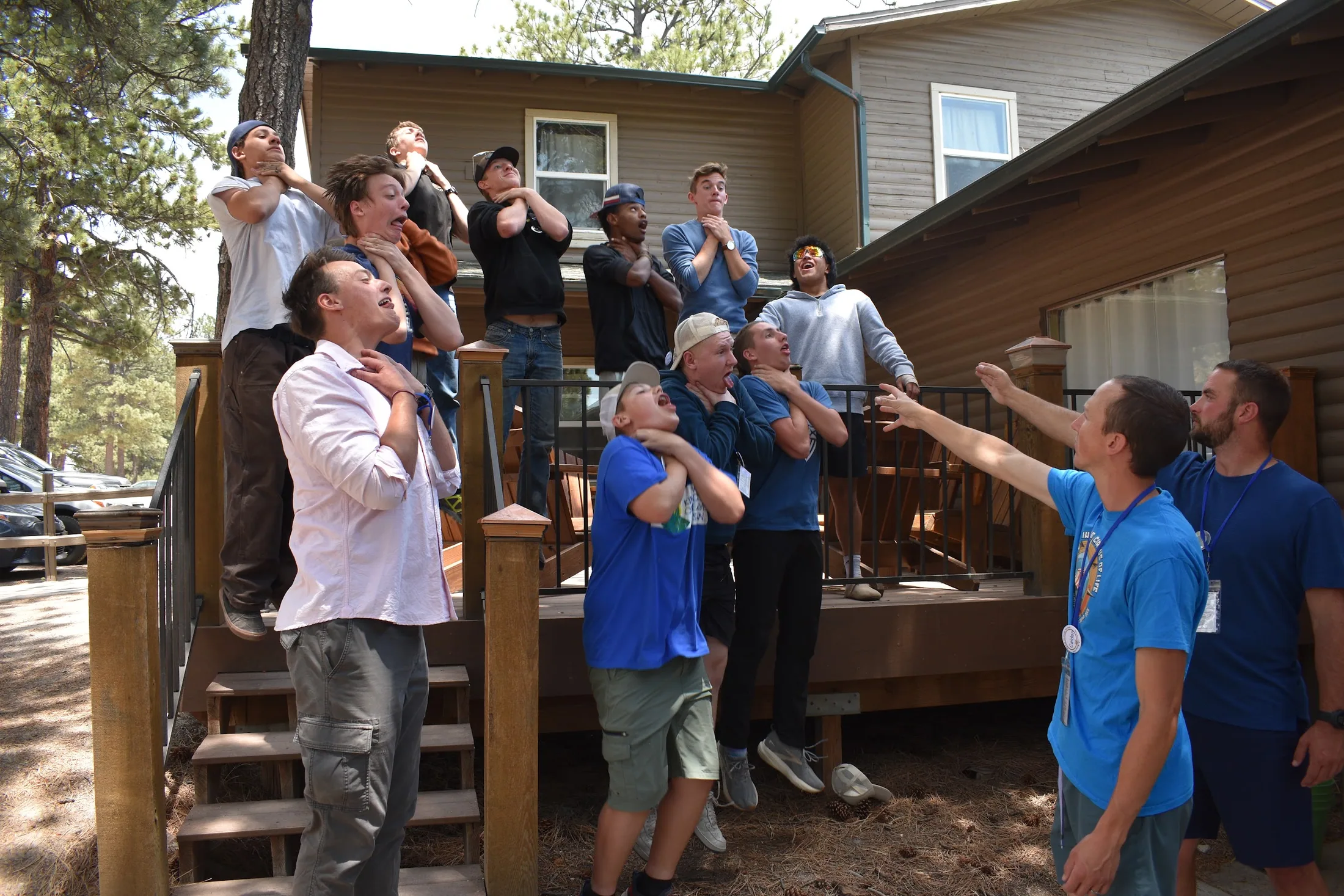 A camp team celebrating together outdoors